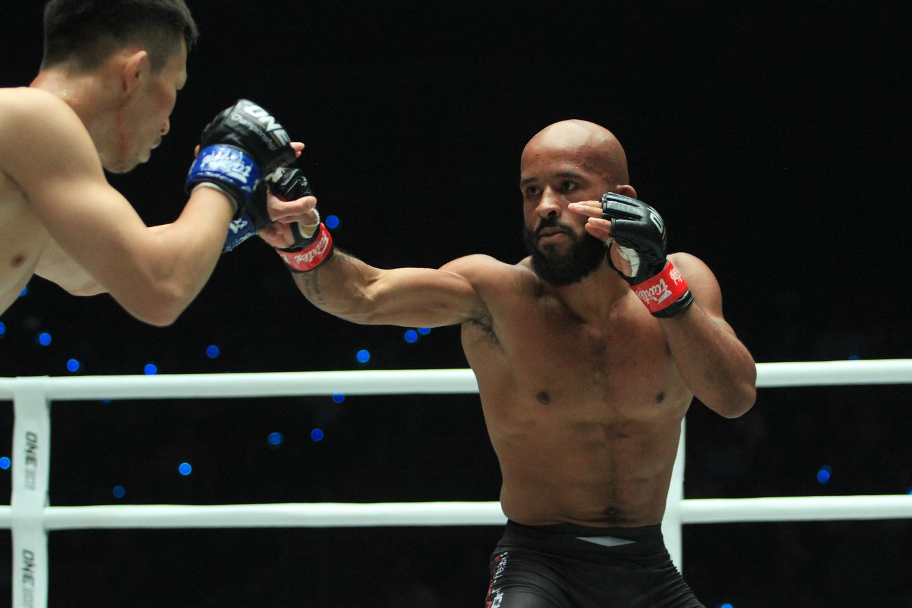 Demetrious Johnson (red gloves), the pound for pound best...
