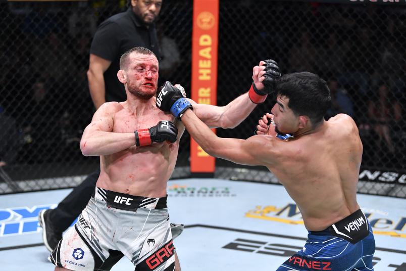 Davey Grant of England and Adrian Yanez punch each other in their bantamweight bout at UFC Fight Night: Vieira vs Tate on November 20, 2021 at the UFC APEX in Las Vegas, Nevada. (Photo by Chris Unger/Zuffa LLC)